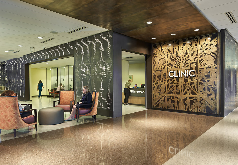 Shiny surfaces are shown in a rendering of a lobby space, with the word "Clinic" atop geometric designs on the far wall