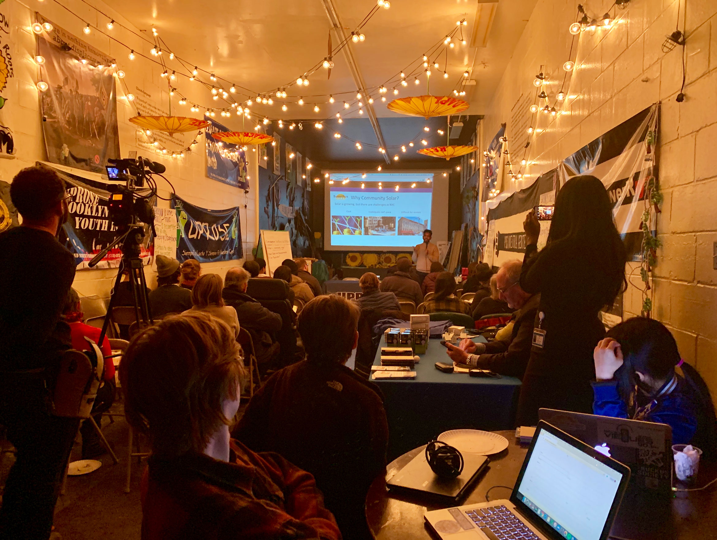 Juan Parra, Community Solar Program Manager at Solar One, addresses members of the Sunset Park community at a March 2019 informational meeting. Image via UPROSE.