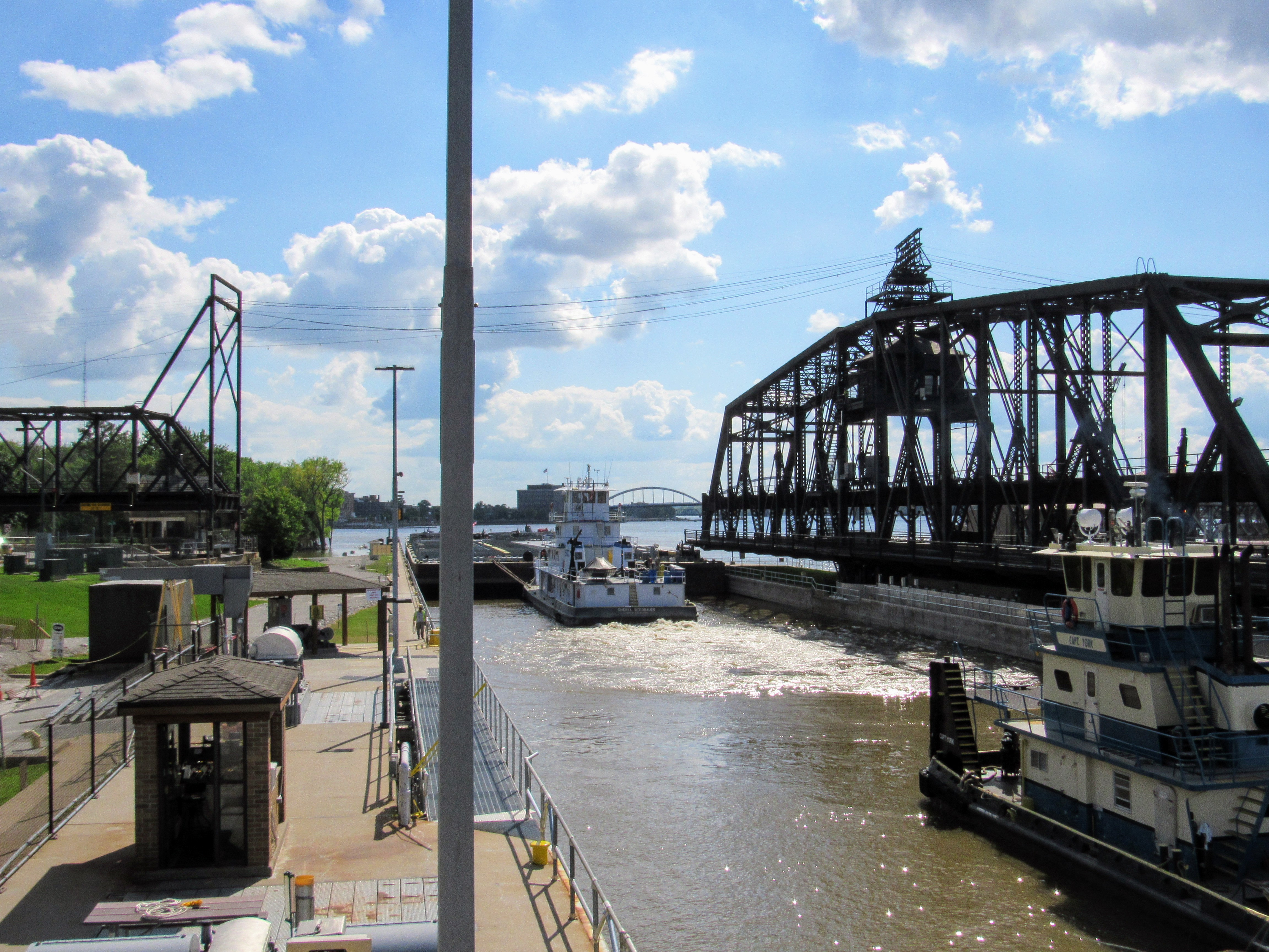 The Cheryl Stegbauer locking through at Lock and Dam #15 in Rock Island, Illinois. In operation since 1896, this section of the Government Bridge must swing open for every tow that passes. The bridge also carries rail and auto traffic across the river. (Avery Gregurich)
