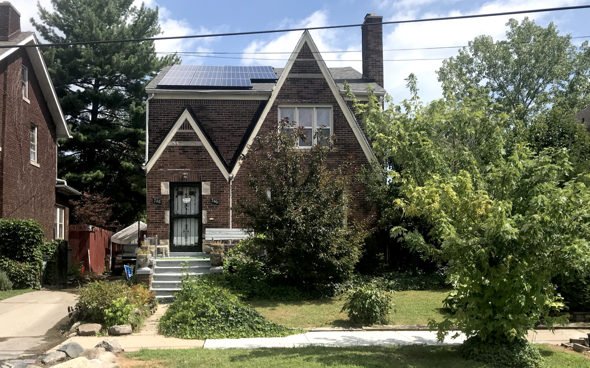 Home on Ashland street in Detroit's Jefferson Chalmers neighborhood recently installed solar panels as its basement flooded with water from the Detroit River