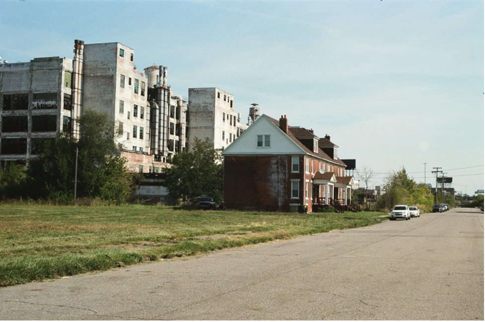 An isolated housing complex is pictured next to the abandoned Fisher Body industrial plant on Harper Avenue in the Milwaukee Junction neighborhood of Detroit, MI.